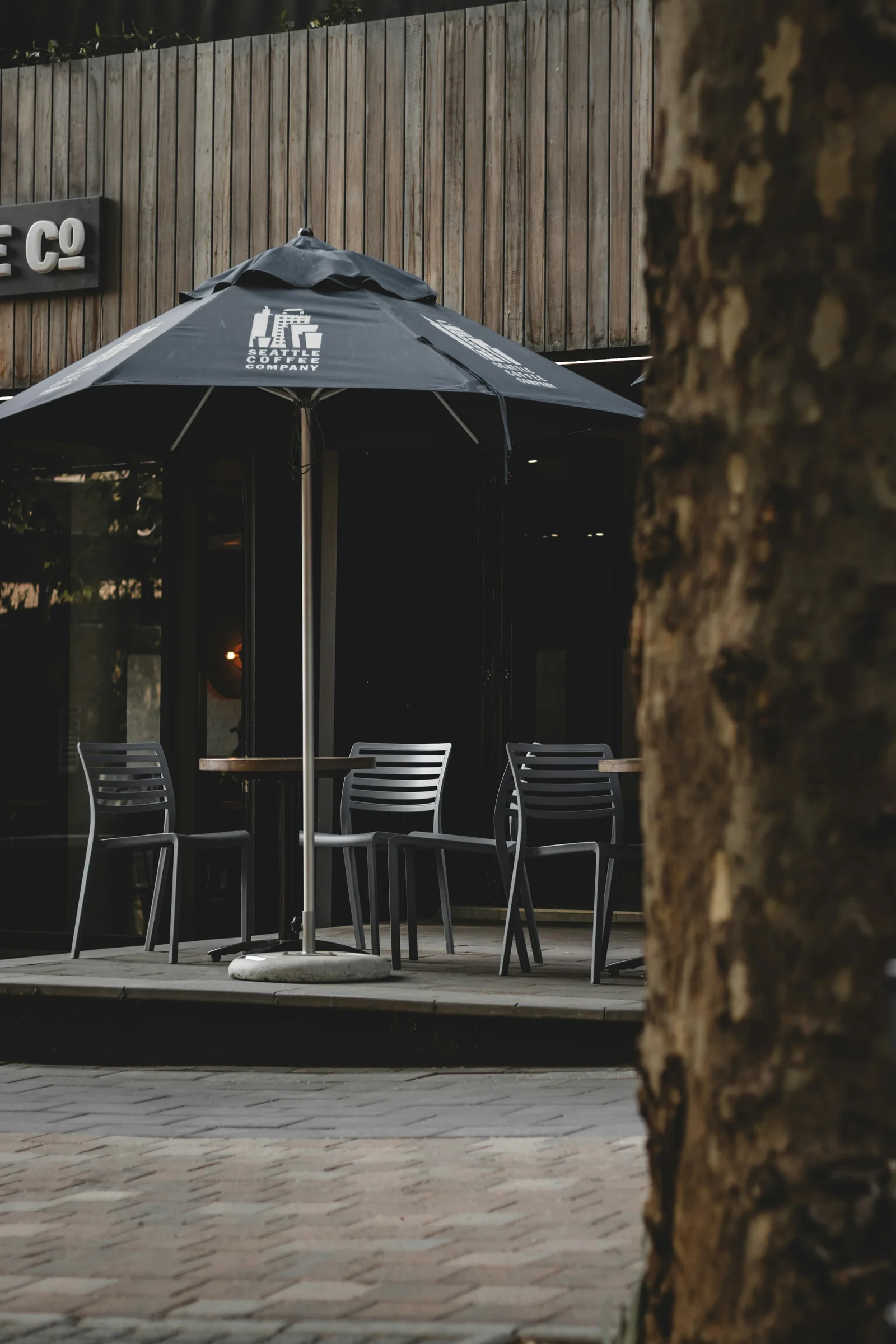 Empty outdoor café tables on a Johannesburg street